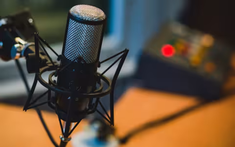A close up picture of a black podcast microphone.