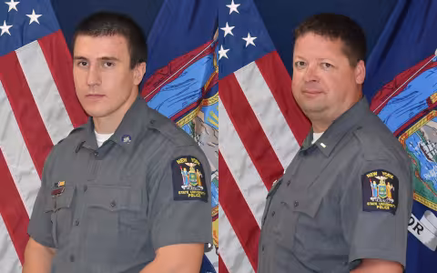 Two UAlbany Police office pose in uniform