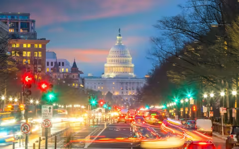 Washington DC at night using a slow shutter speed with the Capitol visible in the distance.