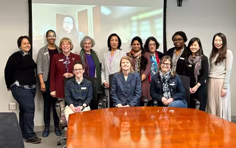 Project SAGES awardees and co-PIs gather in a UAlbany conference room for an all-hands meeting. 