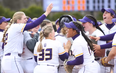 The UAlbany womens softball team celebrates a victory during the 2023 season.