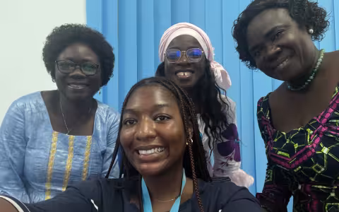 A portrait of Aicha and UNFPA staff.