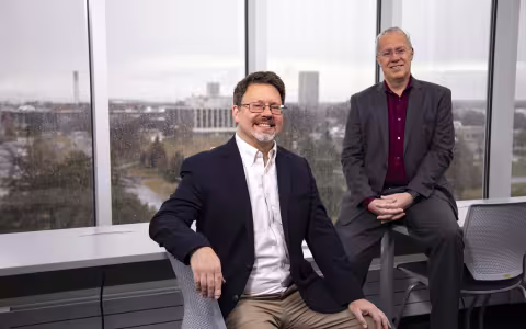 Eric Stern and Chris Thorncroft sit in ETEC's weather observation deck on a rainy day.