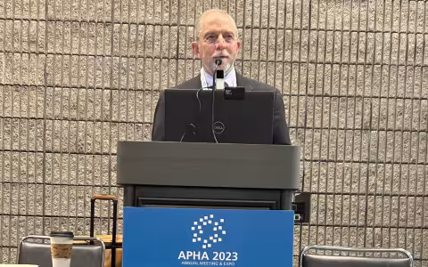 David Hoffman stands behind a podium at APHA 2023.