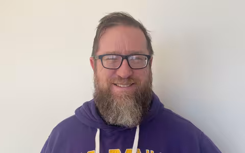 UAlbany PhD student and Graduate Ambassador Scott Pasch smiling for the camera.