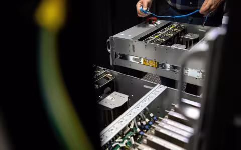 hands are seen installing computer units