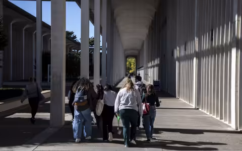 Students walk to class on the UAlbany academic podium.