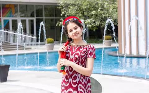 Graduate student Aziza Alimardonova poses in her Tajikistan dress.