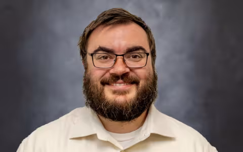 A portrait of Ryan Schneider.
