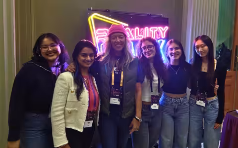 CEHC's Catherine Dumas stands with a group of UAlbany students at the 2025 MIT Reality Hack.