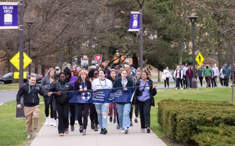 Students walking in last year's Out of the Darkness Walk at UAlbany