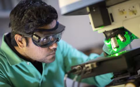 Student working with a microscope