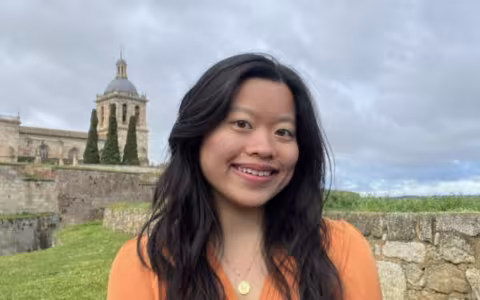 Michelle Dong Sociology Major in front of a castle in Europe.