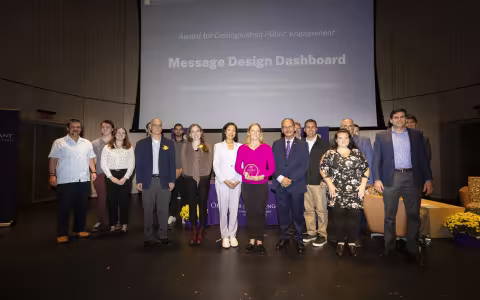 UAlbany researchers accept a campus award for Distinguished Public Engagement.