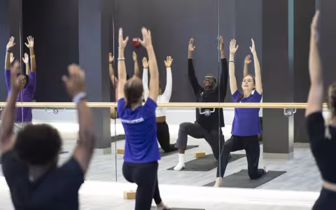 A group of students participate in a wellness class
