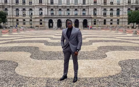 Graduate Ambassador Jeremy Baker poses infront of the Capital Building in Albany, New York.