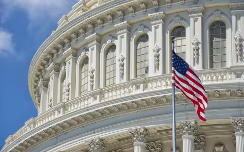 An American Flag waves outside U.S. Capitol Building 