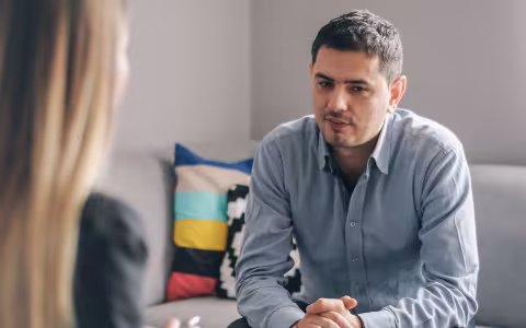 A substance abuse counselor meets with a client in her office.