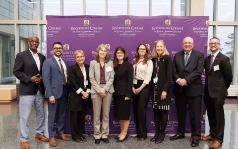 Award winners and college dean Julie Novkov at the 2025 awards ceremony. 