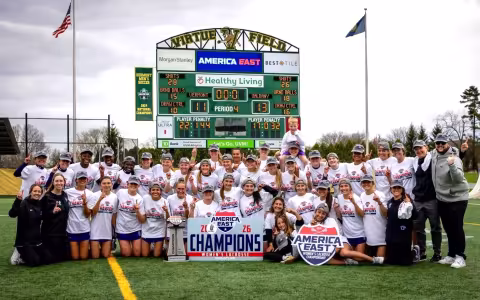 UAlbany's women's lacrosse team celebrates its second straight championship after beating Vermont in Burlington, Vermont.