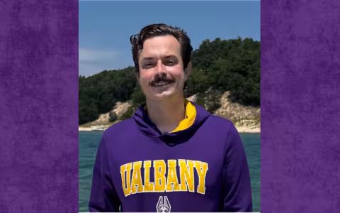 Headshot of Schirmann in a UA sweatshirt