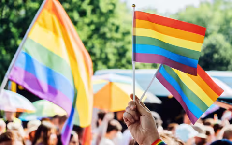 Pride flags at a gathering.