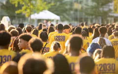 New students walk to the entry plaza during Opening Convocation.