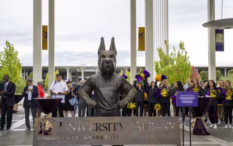 The new Damien statute and bench stand tall on the Academic Podium.