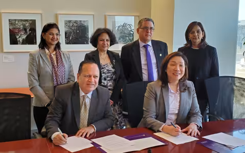 Representatives from NMIMS and UAlbany sign agreement