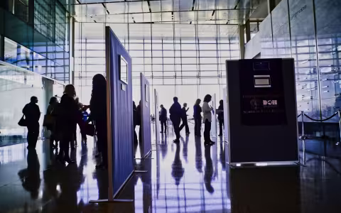 People looking at photos during the 2019 Photovoice event.