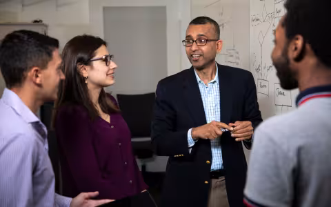 Sanjay Goel collaborating with students