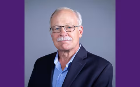 Man smiling at the camera.