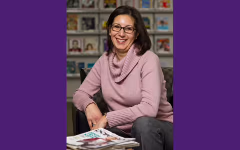 Photo of a woman smiling at the camera.