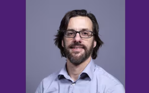 Man smiling at the camera.