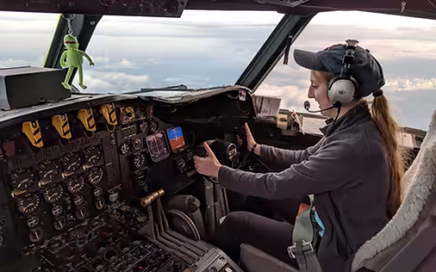 DAES student Emily Paltz flies Kermit – the NOAA42 P-3 Hurricane Hunter – during the OTREC field campaign. (Photo by Brian Richards)