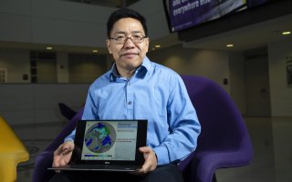 Aiguo Dai shares a graphic of his latest research at University Hall.