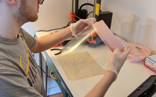 CEAS senior Ian Walter assembles a three-piece medical face shield.