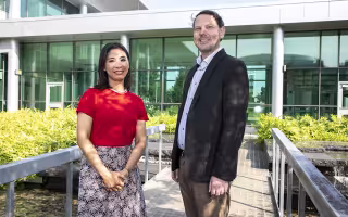 Microbiologists Cheryl Andam and Alex Valm in the UAlbany Life Sciences Building courtyard