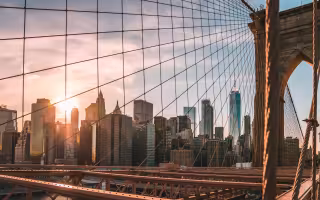 Image of the New York City skyline illuminated by the sun.