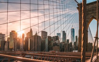 Image of the New York City skyline illuminated by the sun.