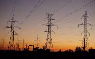 Photo of powerlines at sunset.