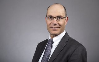 Headshot of Gary Ackerman, associate professor at CEHC.