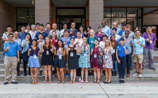 PIRE students stand in front of a building at the National Central University in Taiwan.