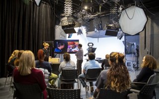 Members of the OCM team give a media training presentation from inside UAlbany's digital media studio.
