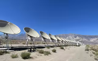 a row of radio astronomy telescopes at the Deep Synoptic Array at Owens Valley Radio Observatory.