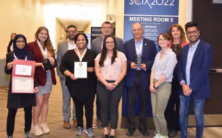 Lednev and two generations of his student researchers accept awards at the Great Scientific Exchange conference in Covington, Ky.