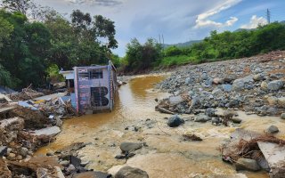 A home in Guayama, Puerto Rico is swept away in floodwaters following Hurricane Fiona.