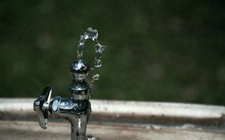 Drinking water fountain spurts water