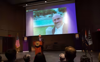 President Rodríguez announces the launch of the Institute for Social and Health Equity at the Spring Address in the Campus Center auditorium.