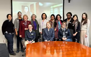 Project SAGES awardees and co-PIs gather in a UAlbany conference room for an all-hands meeting. 